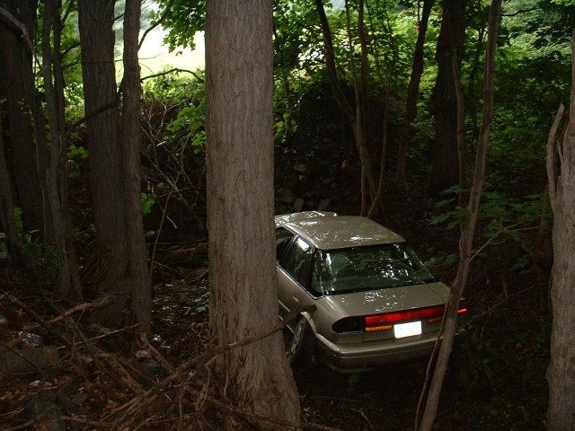 Route 897 is visible in the clearing above the car... 8/9/03